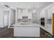 Modern kitchen with white cabinets, quartz counters, and stainless steel appliances at 1182 Lost Cove Rd, Indian Land, SC 29707