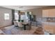 Dining area with a modern table, gray walls, and a patterned rug at 12028 Grinstead Ln # 292, Charlotte, NC 28278