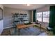 Home office with a large desk and stylish shelving at 12028 Grinstead Ln # 292, Charlotte, NC 28278