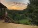 Peaceful sunset view from deck, overlooking expansive backyard and trees at 1262 Ring Tail Rd, Claremont, NC 28610