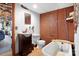 Basement bathroom with a clawfoot tub and exposed brick at 1262 Ring Tail Rd, Claremont, NC 28610