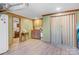 Small basement kitchenette with wood cabinets and laminate floor at 1262 Ring Tail Rd, Claremont, NC 28610