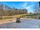 Enjoy this spacious wooden deck with rocking chairs and a picnic table under a clear blue sky at 1262 Ring Tail Rd, Claremont, NC 28610