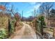 Gravel drive leads to the property through a charming gate at 1262 Ring Tail Rd, Claremont, NC 28610