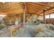 Large hay barn filled with hay bales, featuring wooden beams and support posts at 1262 Ring Tail Rd, Claremont, NC 28610