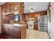 Country kitchen with wood cabinets and stainless steel appliances at 1262 Ring Tail Rd, Claremont, NC 28610