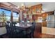 Charming eat-in kitchen with wood cabinets, stainless appliances and a large wooden dining table at 1262 Ring Tail Rd, Claremont, NC 28610