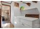 Bright laundry room featuring a white washer and dryer and ample storage space at 1262 Ring Tail Rd, Claremont, NC 28610