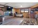 Cozy living room features a brick fireplace, wood paneling, and comfortable lounging area at 1262 Ring Tail Rd, Claremont, NC 28610