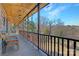 Wooden porch with wooden railings overlooking the backyard at 1262 Ring Tail Rd, Claremont, NC 28610