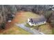 Aerial view of a ranch house with a large yard and driveway at 127 Halifax Ct, Gastonia, NC 28056