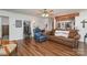 Living room with brown sofa, recliner, and hardwood floors at 127 Halifax Ct, Gastonia, NC 28056