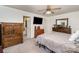 Main bedroom with dresser, TV and carpeted floor at 127 Halifax Ct, Gastonia, NC 28056