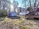 Large backyard with storage shed and mature trees at 1716 Dallas Ave, Charlotte, NC 28205