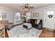 Living room with gray walls, hardwood floors, and comfy seating at 1716 Dallas Ave, Charlotte, NC 28205