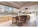 Relaxing back porch featuring wooden rocking chairs and views of the fenced yard at 1721 Gold Hill Rd, Concord, NC 28025