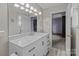 Bright bathroom featuring a marble countertop vanity and neutral paint at 1721 Gold Hill Rd, Concord, NC 28025