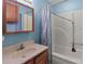 Cozy bathroom features a vanity with sink, medicine cabinet, and shower-tub combination at 1721 Gold Hill Rd, Concord, NC 28025