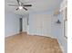 Light filled bedroom with a ceiling fan and laminate flooring at 1721 Gold Hill Rd, Concord, NC 28025