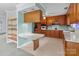 Kitchen with wood cabinets, white appliances, and ample counter space at 1721 Gold Hill Rd, Concord, NC 28025