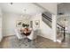 Dining area featuring a modern chandelier and staircase nearby at 17521 Cambridge Grove Dr, Huntersville, NC 28078