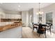 Bright kitchen featuring granite countertops and adjacent dining area at 17521 Cambridge Grove Dr, Huntersville, NC 28078