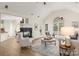 Inviting living room with high ceilings, a fireplace, ample natural light, and comfortable seating at 17521 Cambridge Grove Dr, Huntersville, NC 28078