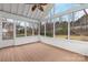 A bright screened porch with wood floors providing seamless indoor-outdoor living at 17521 Cambridge Grove Dr, Huntersville, NC 28078