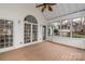 Charming screened porch with views, featuring a wood floor and white trim details at 17521 Cambridge Grove Dr, Huntersville, NC 28078