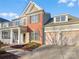 Two-story brick home with a large front porch and attached two-car garage at 18414 Victoria Bay Dr, Cornelius, NC 28031