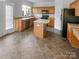 Kitchen features an island and stainless steel appliances at 18414 Victoria Bay Dr, Cornelius, NC 28031