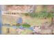 An aerial shot reveals a neighborhood, a clear lot, and multiple homes at 1876 Rollins Dr, Catawba, NC 28609