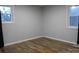 Bright bedroom featuring wood-look floors and gray walls at 1876 Rollins Dr, Catawba, NC 28609