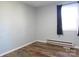 Simple bedroom with wood-look floors and gray walls at 1876 Rollins Dr, Catawba, NC 28609