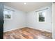 Empty bedroom with light blue walls and wood-look flooring, ready for personalization at 1876 Rollins Dr, Catawba, NC 28609