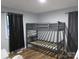 Bedroom with bunk beds, gray walls, and wood-look floors at 1876 Rollins Dr, Catawba, NC 28609