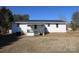 Rear view of the house showing a back porch and yard at 1876 Rollins Dr, Catawba, NC 28609