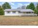 Charming single-story home with a metal roof and inviting front porch at 1876 Rollins Dr, Catawba, NC 28609