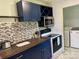 Updated kitchen with dark blue cabinetry, wood countertops, and stainless steel appliances at 1876 Rollins Dr, Catawba, NC 28609