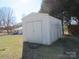 White storage shed in the backyard at 1876 Rollins Dr, Catawba, NC 28609