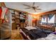 A bedroom with wood paneling, ceiling fan, and built-in storage, offering a cozy space at 1900 E Dixon Blvd, Shelby, NC 28152