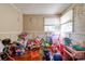 Cozy bedroom with hardwood floors, a ceiling fan, and lots of toys at 1900 E Dixon Blvd, Shelby, NC 28152