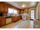 Cozy kitchen features tile flooring, wood cabinets, a white oven, and ample counter space at 1900 E Dixon Blvd, Shelby, NC 28152