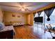 Inviting living room with hardwood floors, a ceiling fan, and a large window overlooking the backyard at 1900 E Dixon Blvd, Shelby, NC 28152