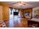 Living area featuring a brick fireplace, hardwood floors, and a large window at 1900 E Dixon Blvd, Shelby, NC 28152