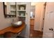 Half bath features stylish glass sink, wood countertop, built-in shelving, and decor at 198 Clouse Ln, Taylorsville, NC 28681
