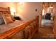 Bedroom with rustic log bed frame and soft bedding at 198 Clouse Ln, Taylorsville, NC 28681