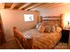 Rustic bedroom with log bed frame and neutral decor at 198 Clouse Ln, Taylorsville, NC 28681