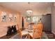 Open concept dining area with modern chandelier, glass table, and stylish decor at 198 Clouse Ln, Taylorsville, NC 28681