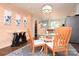 Modern dining area with stylish furnishings, accent wall, and elegant chandelier at 198 Clouse Ln, Taylorsville, NC 28681